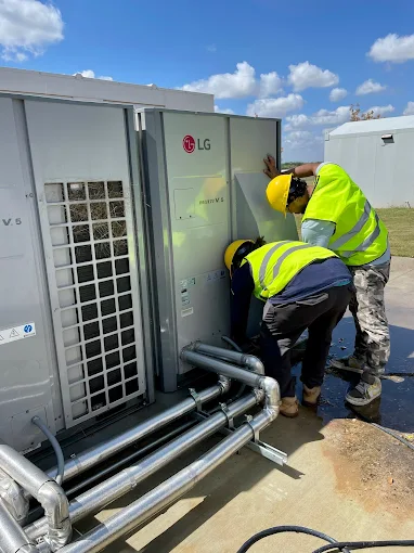 A-OK Services Technician Servicing Commercial Refrigeration Equipment