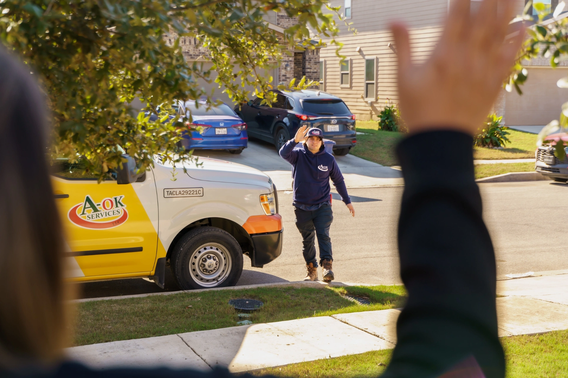 A-OK Services AC maintenance technician performing system inspection